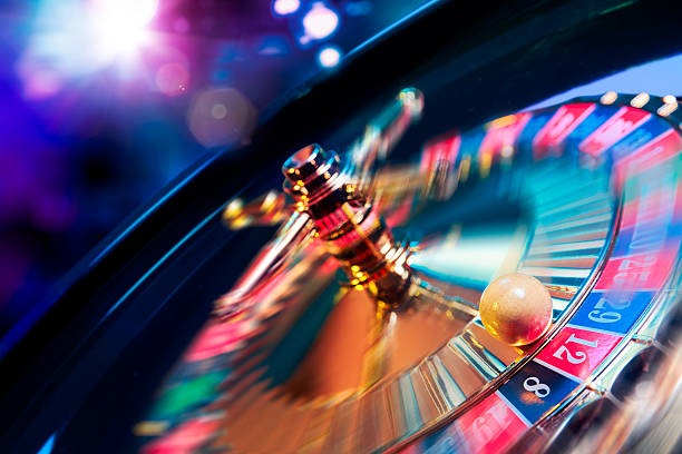 Live casino studio with multiple dealer tables and professional lighting